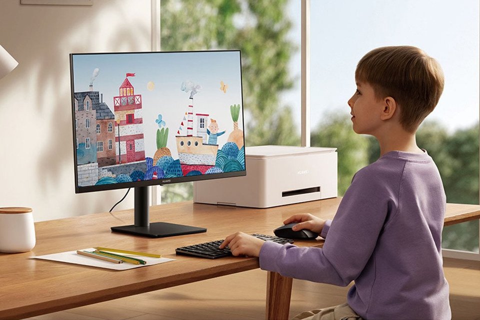 A boy playing a game on computer.